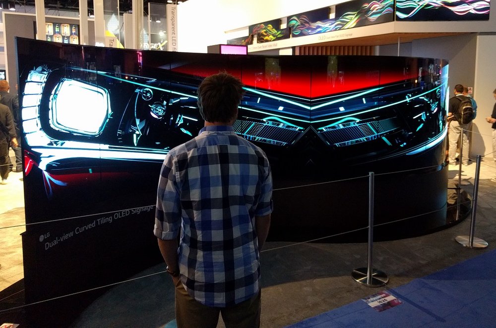 LG’s curved OLED display is perfect for pop-up advertising in the car industry.