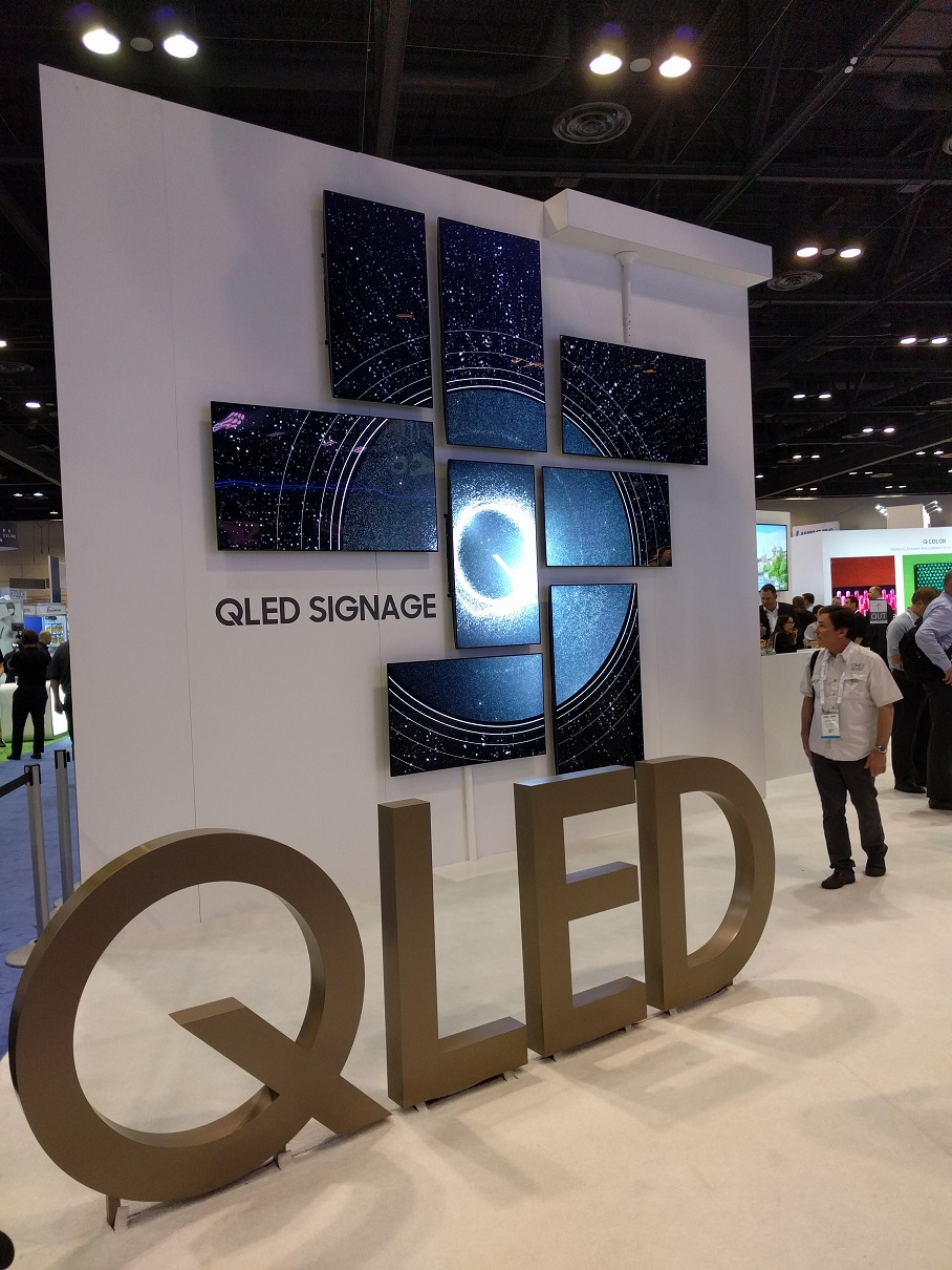 Samsung’s QLED monitors arranged in tiles to form a creative signage.